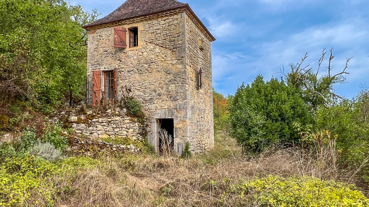 Stone pigeonnier with characterful barn and woodland on 3,866 m² of ...